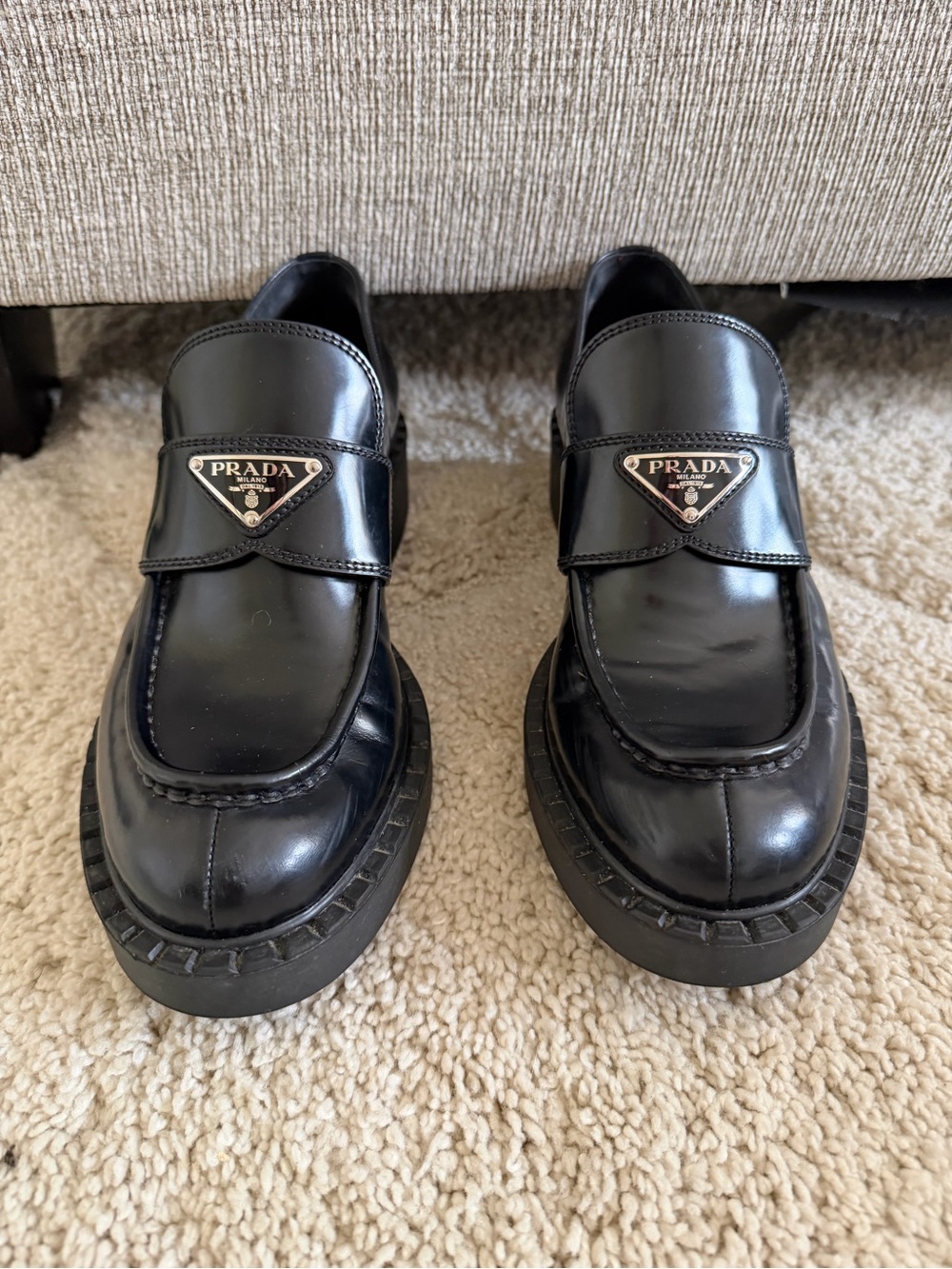 Prada Black Leather Moc Toe Slip-On Loafers with Metal Logo Plaque